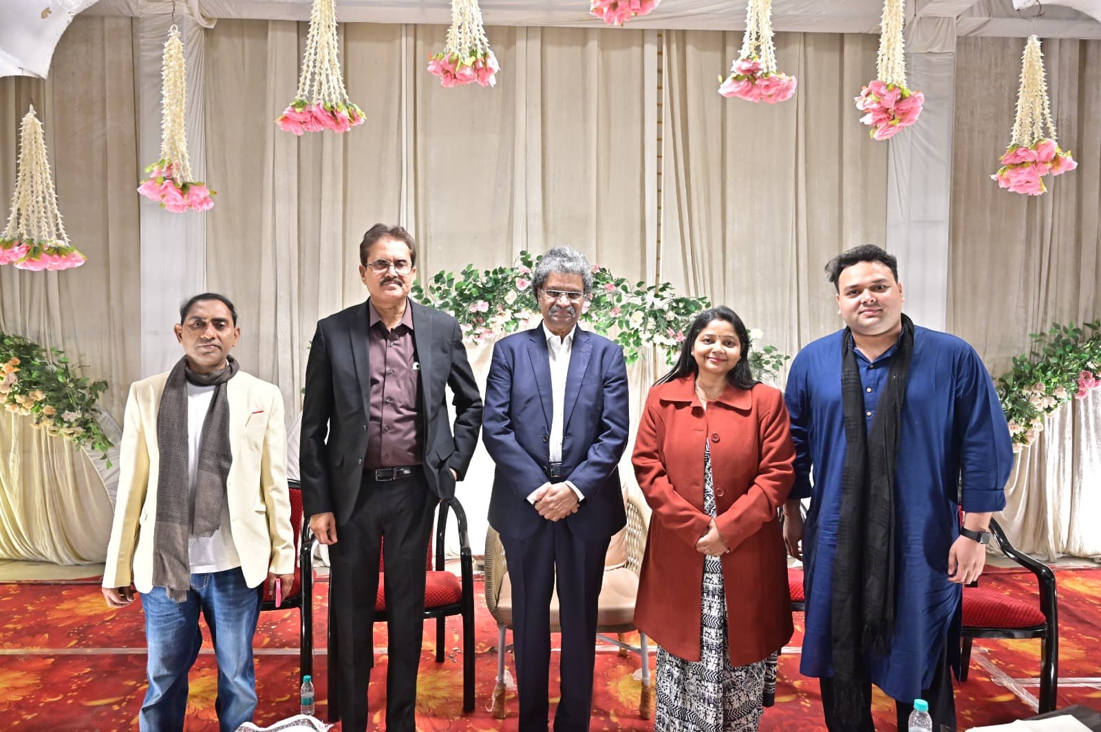 Poetry event speakers and organisers gathered on stage at Adarsh Vatika