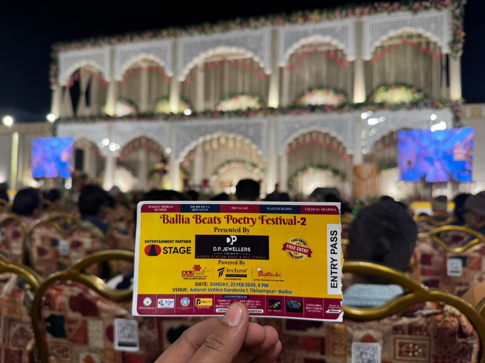 Ballia Beats Poetry Festival entry pass held in front of the event stage