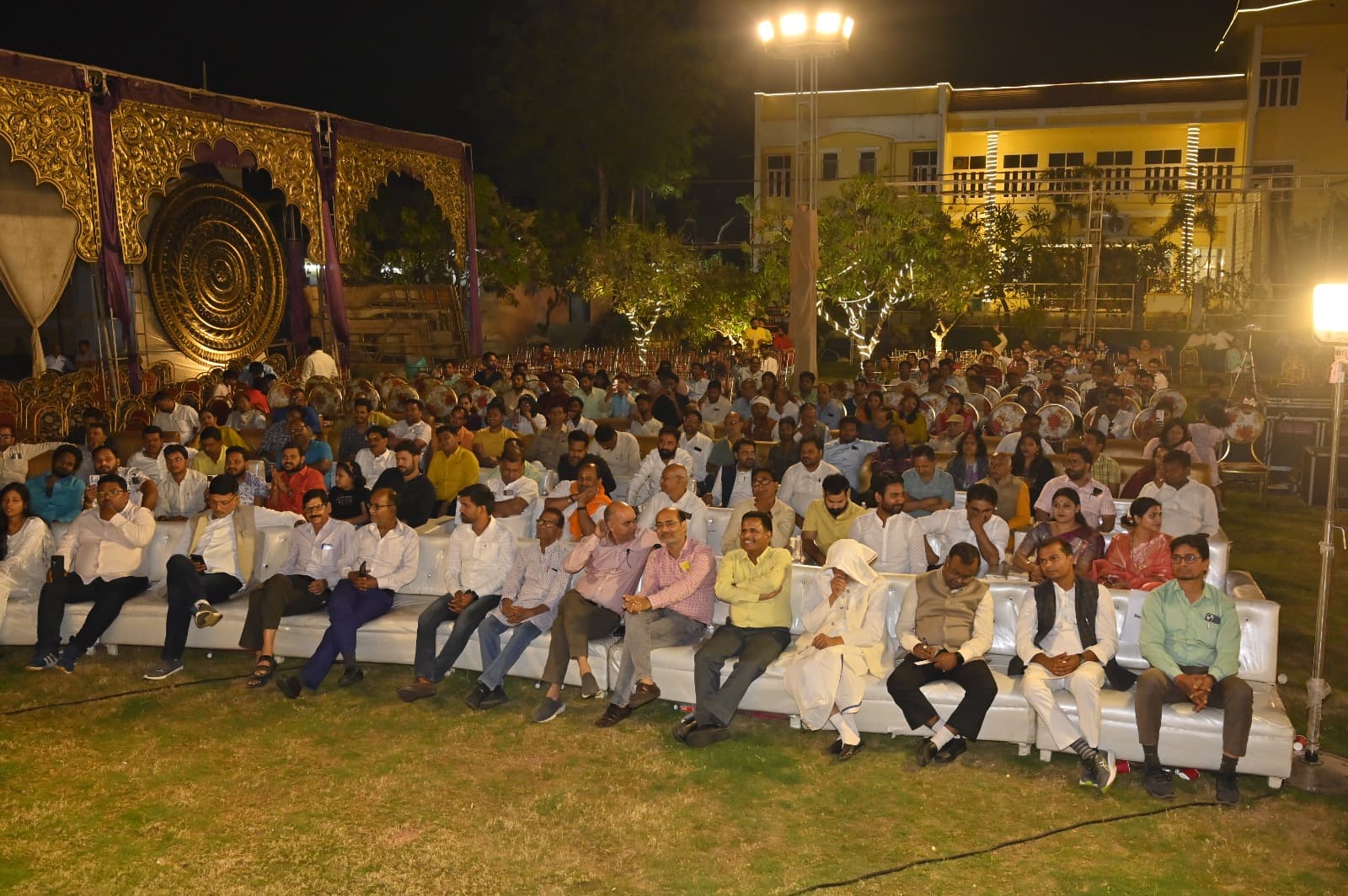 Audience seated for an outdoor cultural programme at Adarsh Vatika