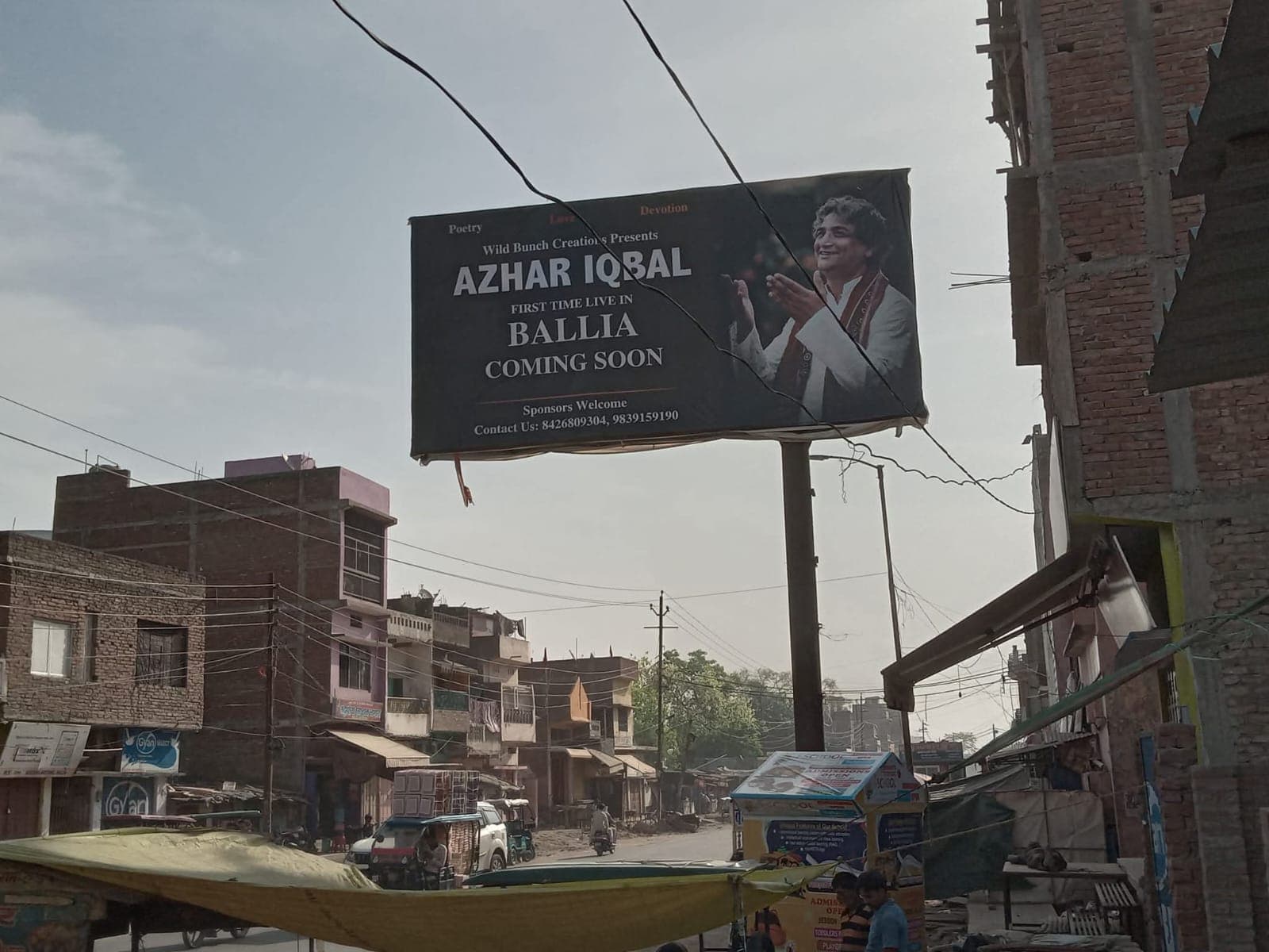 Street billboard announcing a forthcoming poetry performance in Ballia