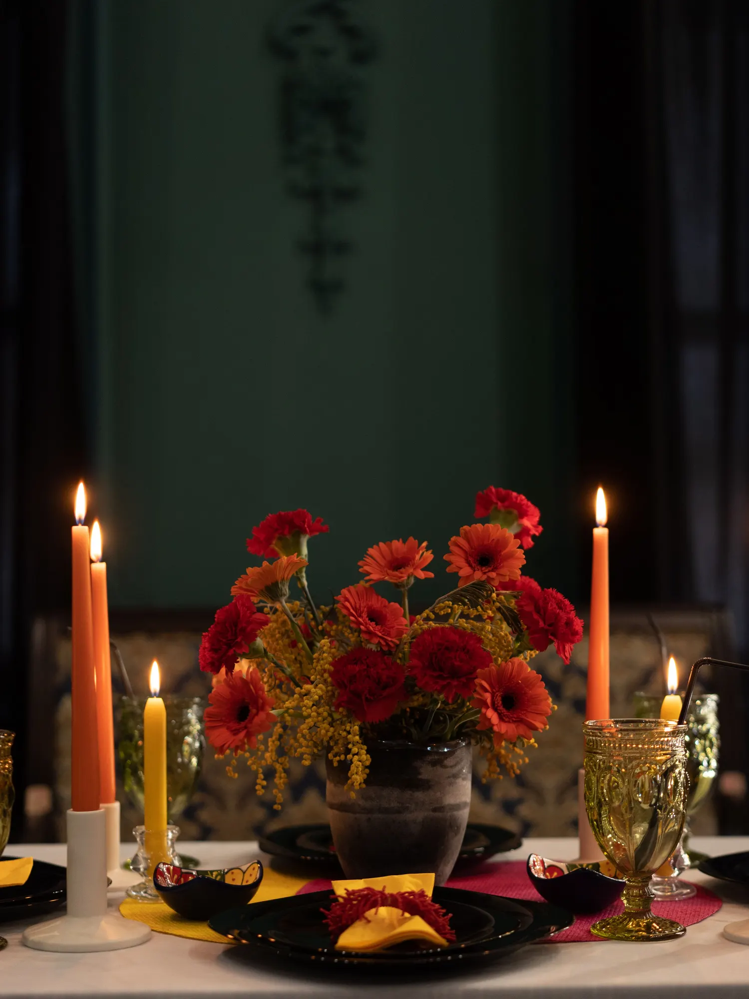 Temporary concept image of candlelit table setting with a floral centrepiece; not property photography.